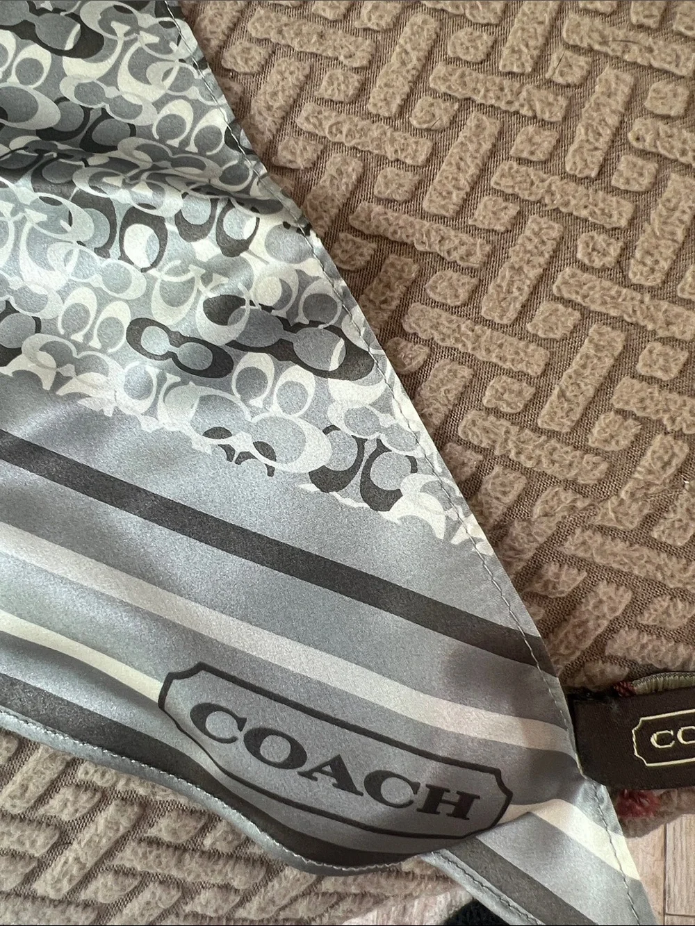 NWT 100% silk Coach Gray and White Signature Pattern scarf.